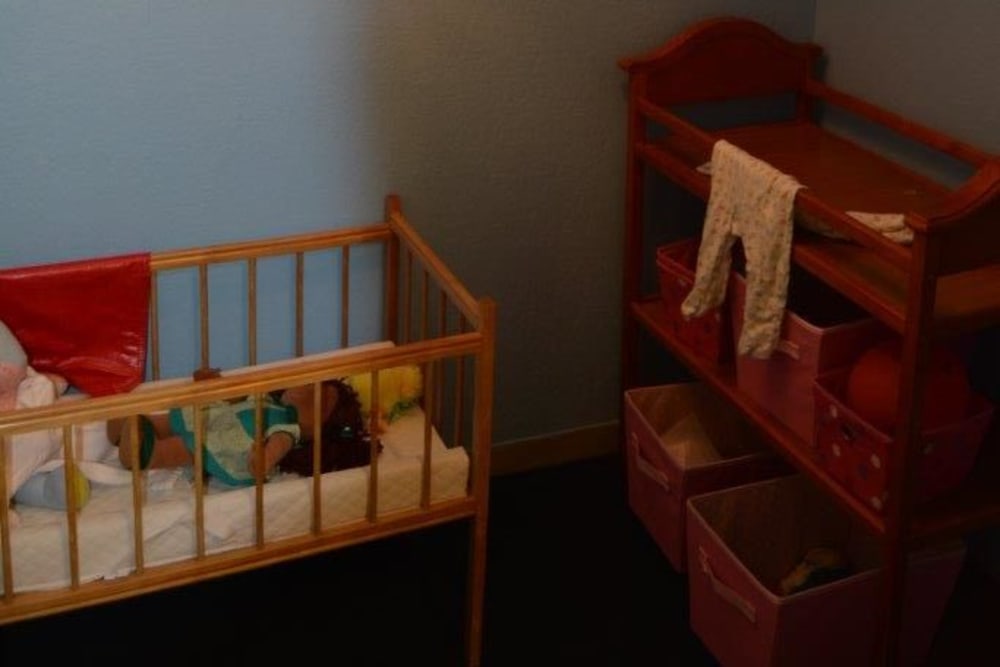 Resident activity area with dolls at Courtyard Estates at Hawthorne Crossing in Bondurant, Iowa.