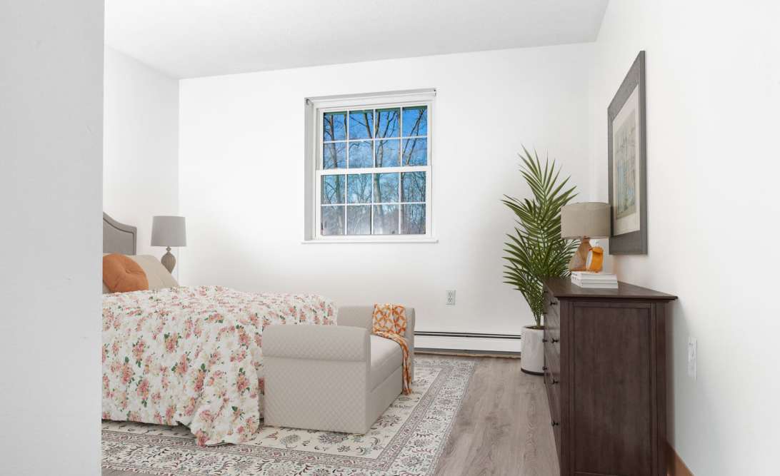 Cozy bedroom with a bed at Framingham Green in Framingham Massachusetts