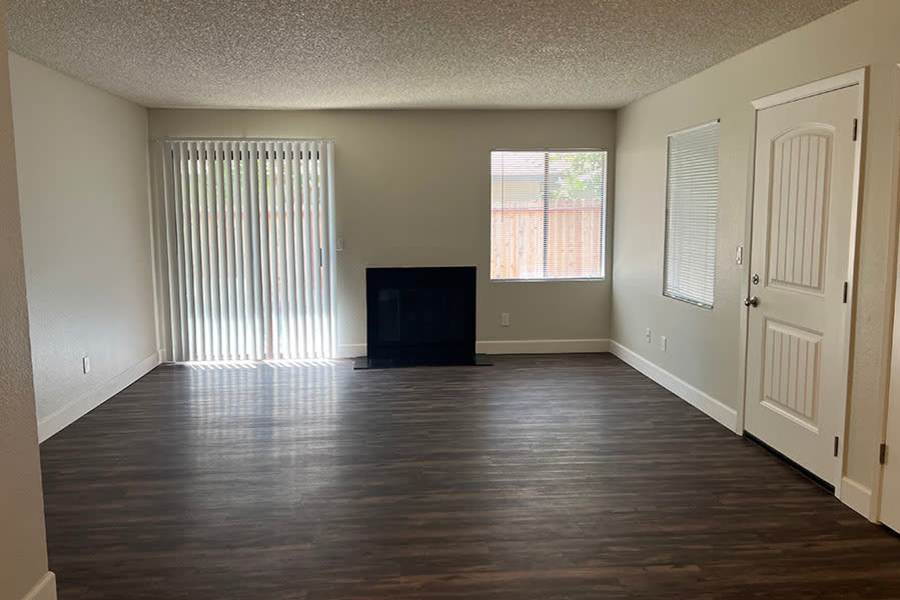 Model living room with hardwood floors at Ashford Park in Sacramento, California