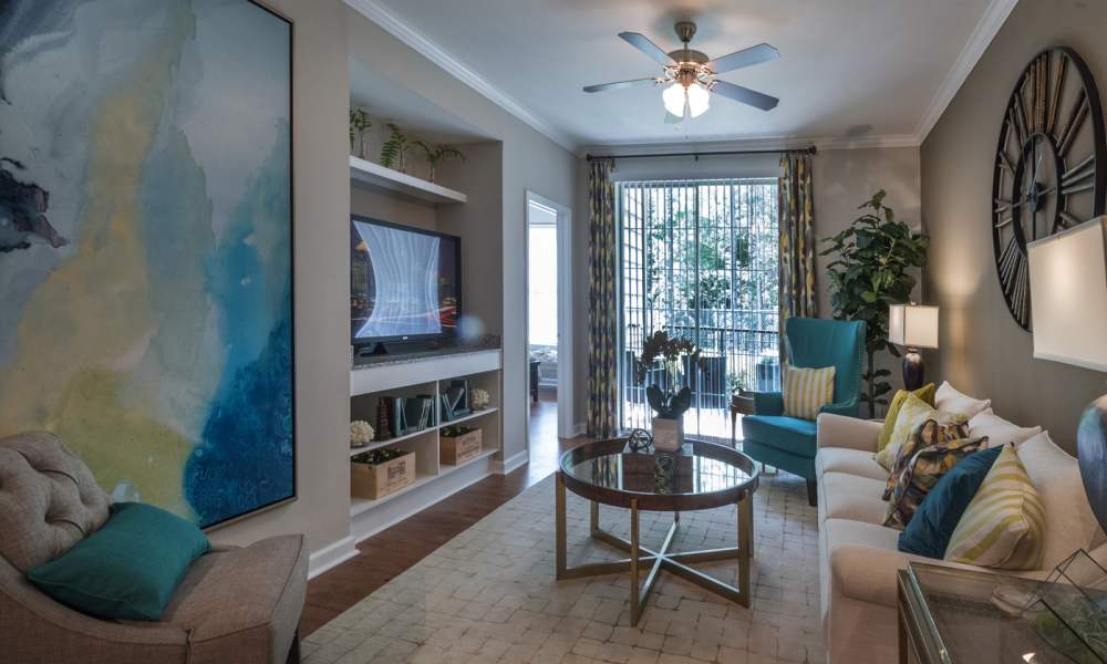 Model living space with large rug Avonlea On The River in Duluth, Georgia
