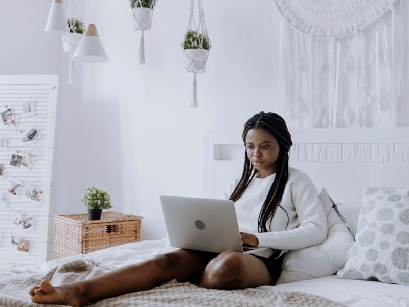 Resident working on her computer at Fieldstone Apartment Homes in Mebane, North Carolina