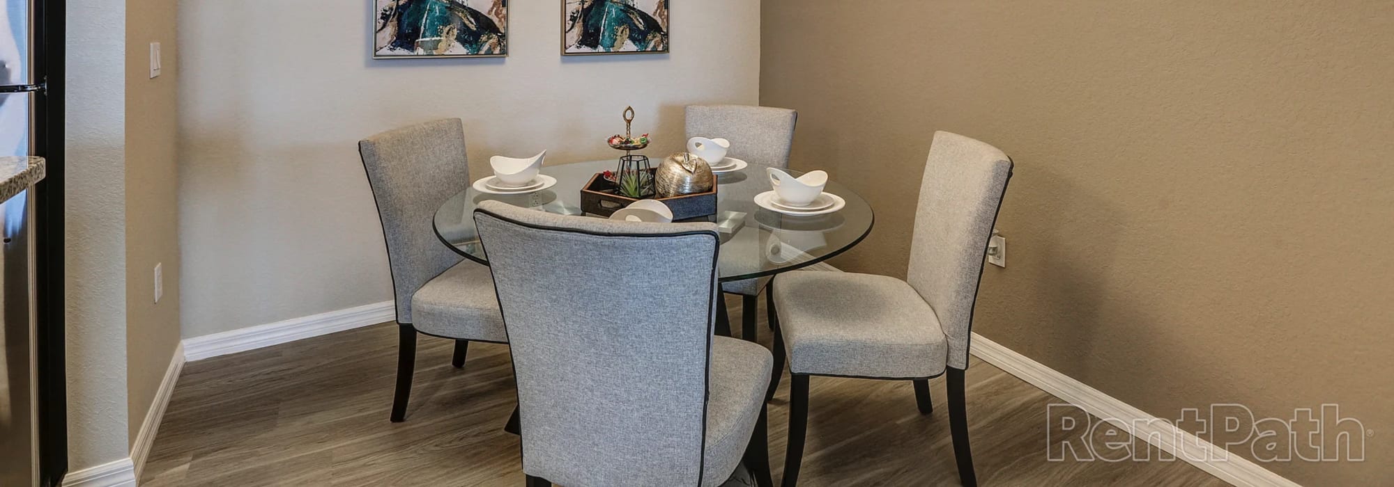 Charming dining nook adorned with elegant decor, perfect for intimate gatherings at Lemon Bay Apartments in Englewood, Florida.