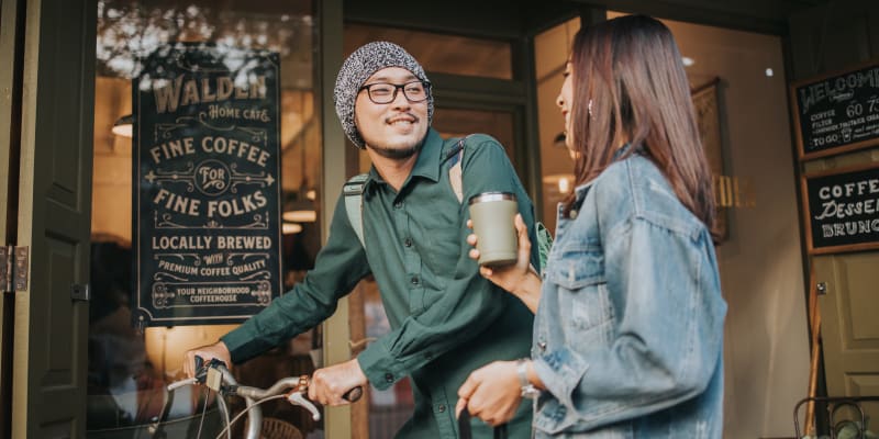 Residents outside a coffee shop near Rolling Park Apartments in Windsor Mill, Maryland