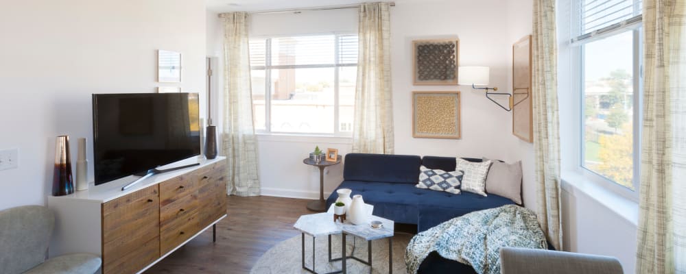 Open-concept living area in a model home at The Bixby in Washington, District of Columbia