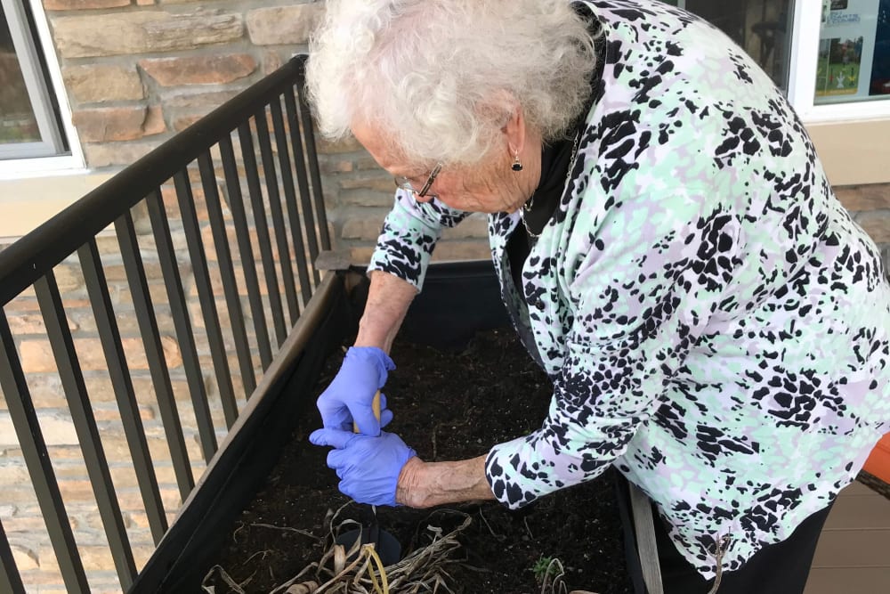 Resident enjoying time garden at Edencrest at Riverwoods in Des Moines, Iowa