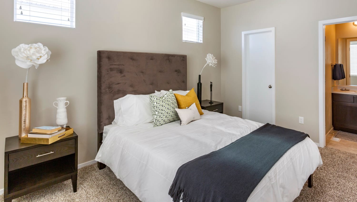 Furnished model bedroom at Olympus at the Canyons in Herriman, Utah