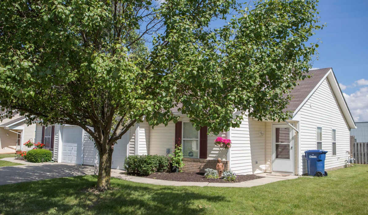Apartments surrounded by greenery at Broadway Village Apartments in Greenfield,Indiana