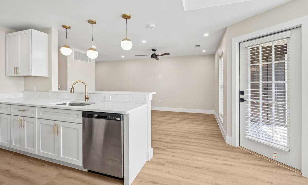 View of the living room from the kitchen at Lake Meadows in Garland, Texas