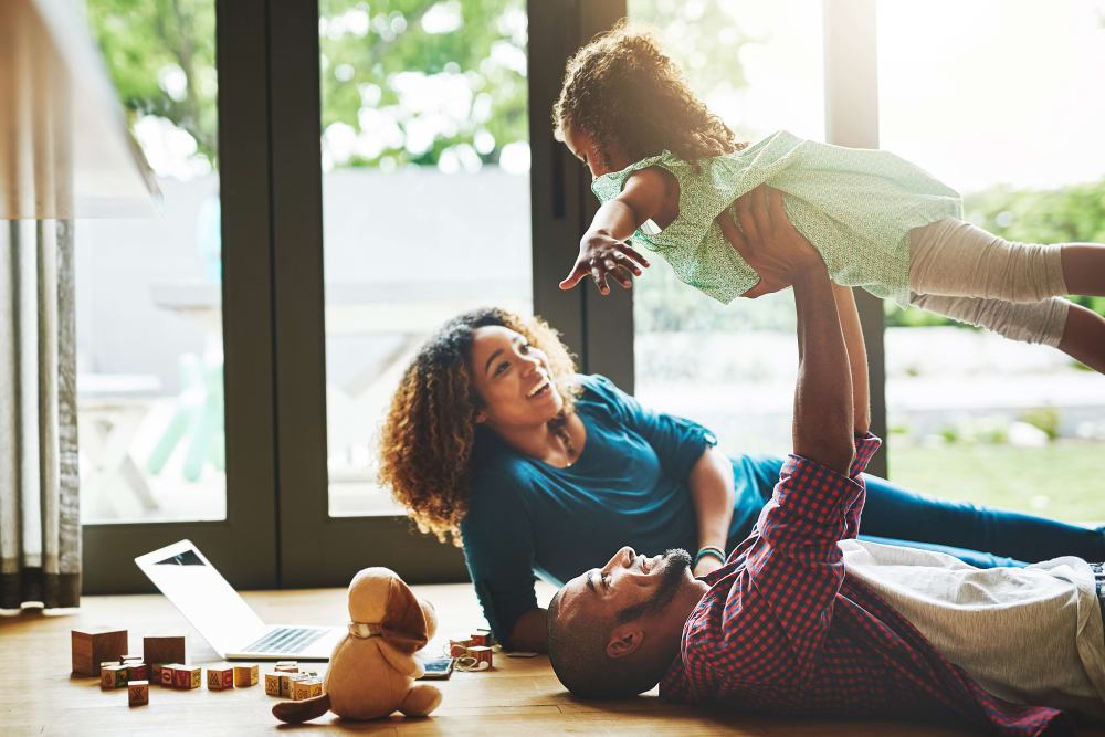 A family enjoying their apartment at Lakeview Village Apartments in Spring Valley, California