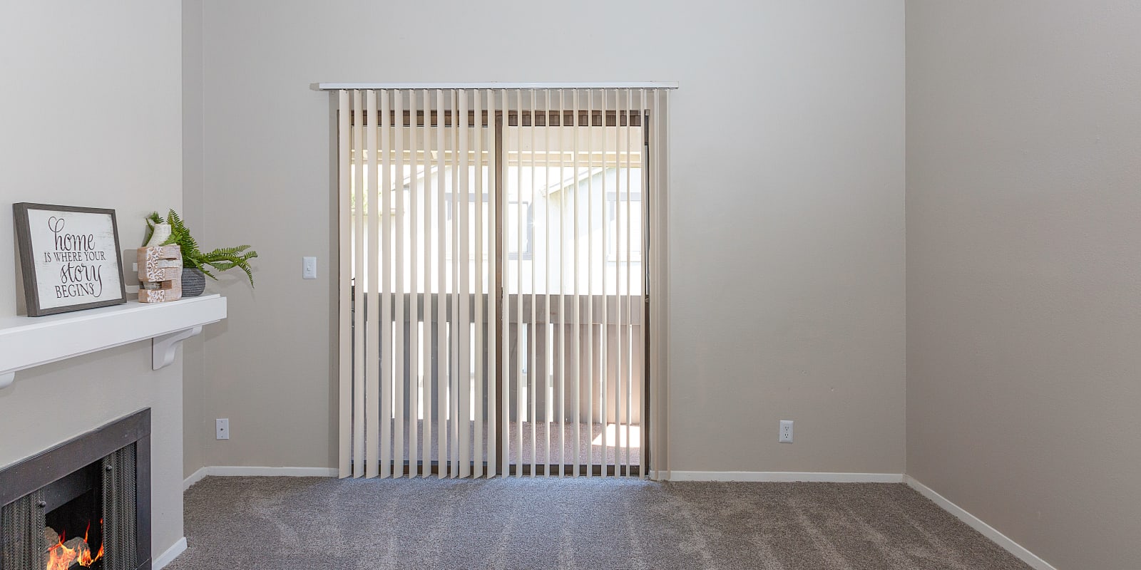 Open floor plan with fireplace at Springs of Country Woods Apartments in Midvale, Utah