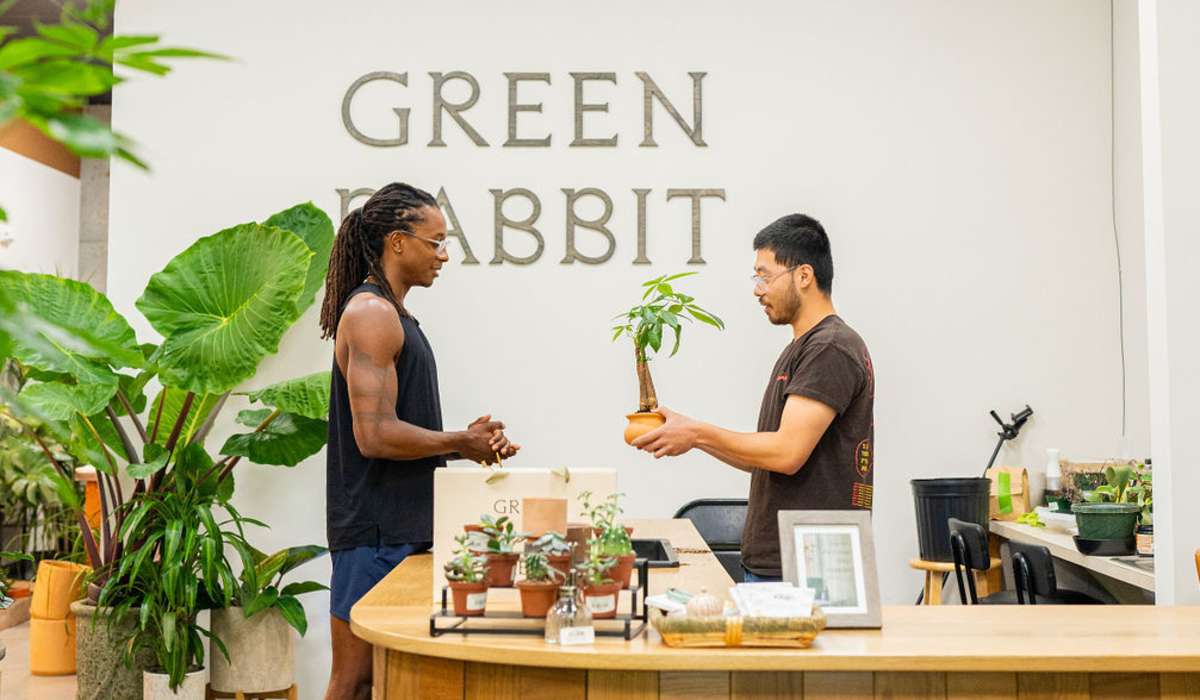 resident buying a plant near Channel House in Raleigh, North Carolina