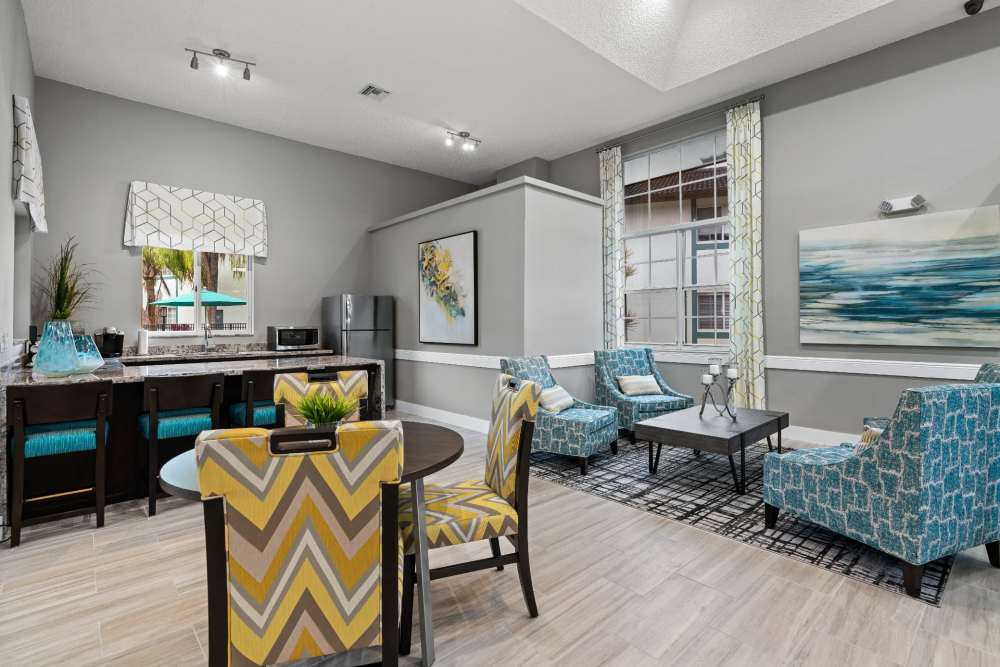 Resident clubhouse with cafe area and lounge at Nova Central Apartments in Davie, Florida