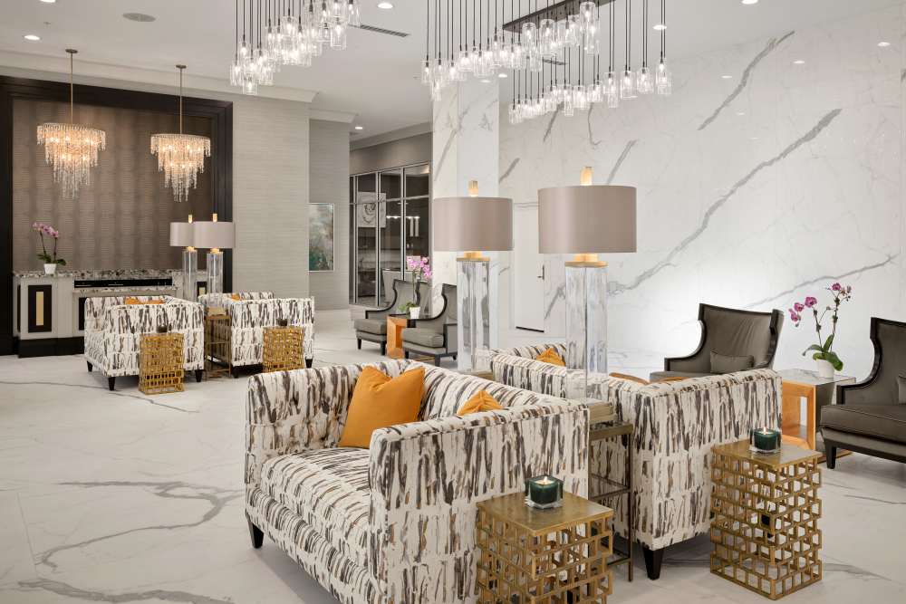 Spacious seating area for senior residents at The Barclay at ParkSquare in Aventura, Florida