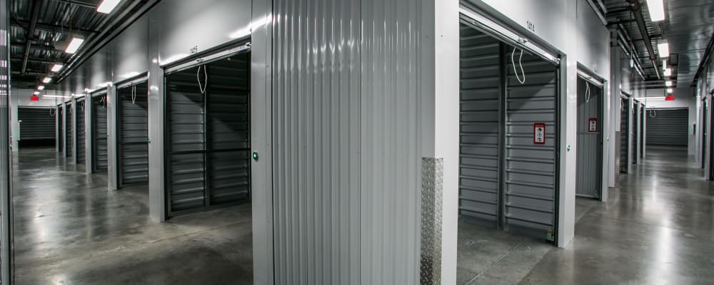 Indoor storage units with open doors at Golden State Storage - Blue Diamond in Las Vegas, Nevada