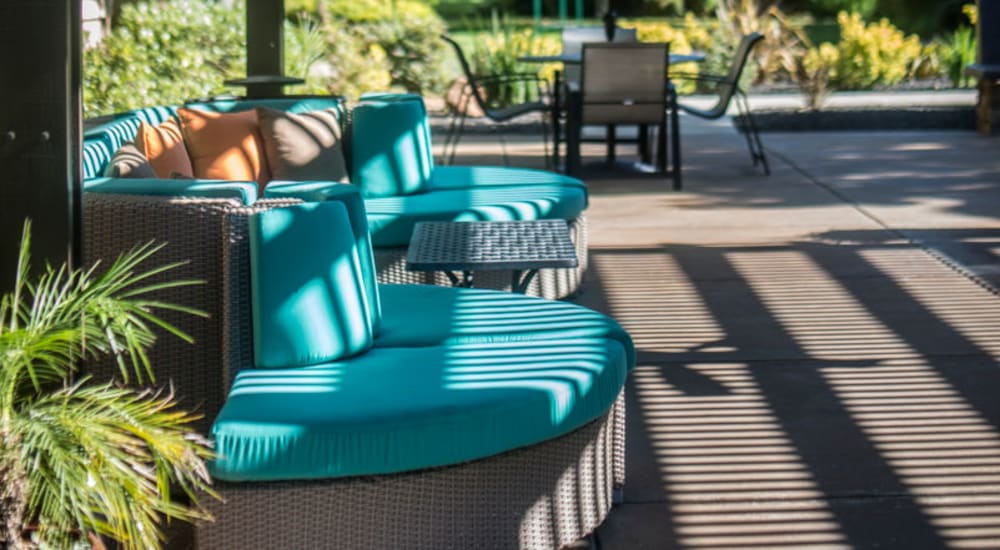 Lounge seating by the pool at Vineyard Gate Apartments in Roseville, California