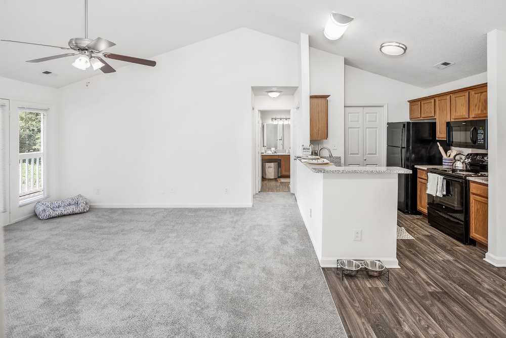 Spacious interior of an apartment with connecting kitchen at Huntersville Commons in Huntersville, North Carolina