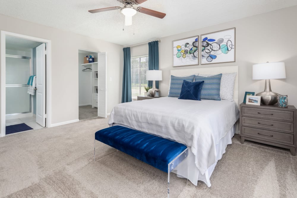 Well-decorated bedroom in model home at Verse at Royal Palm Beach in Royal Palm Beach, Florida