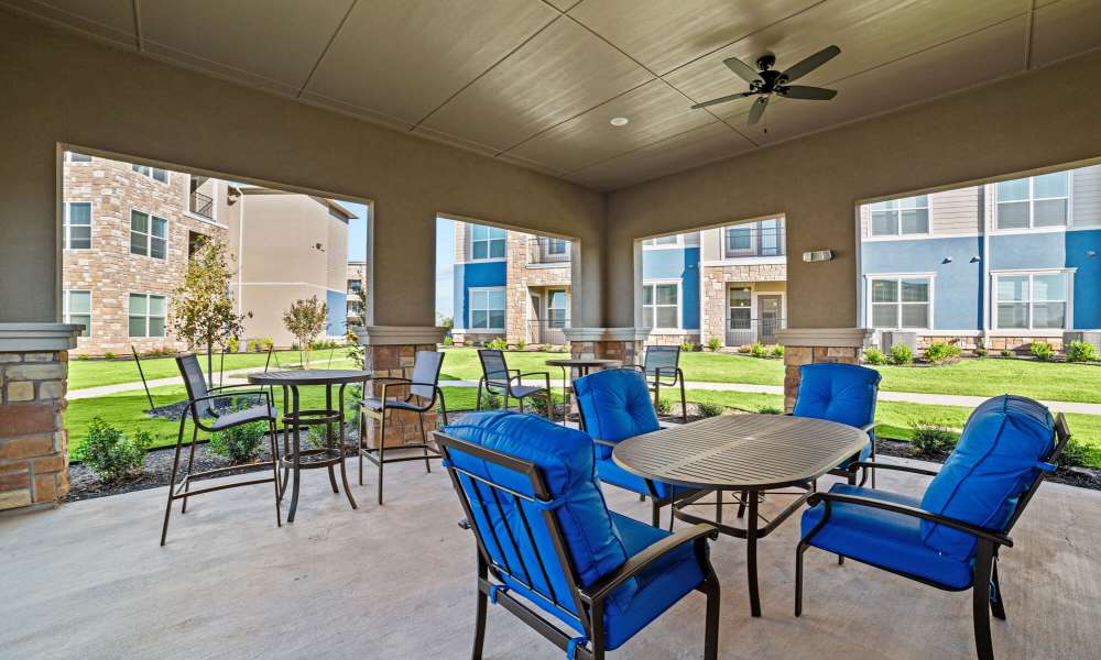 Seating area near pool at Brook Hollow in Wichita Falls, Texas