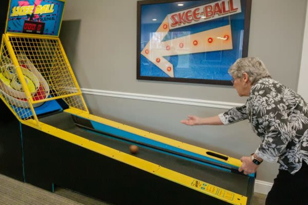 A resident playing skee-ball at Mercer Hill at Doylestown in Doylestown, Pennsylvania