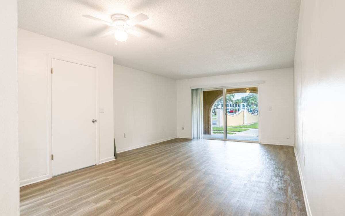 Living room with access into the private balcony at San Jose in Winter Park, Florida