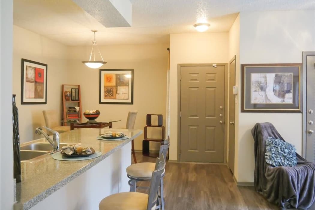 Spacious living room and dining area of model home at Veridian Place in Dallas, Texas
