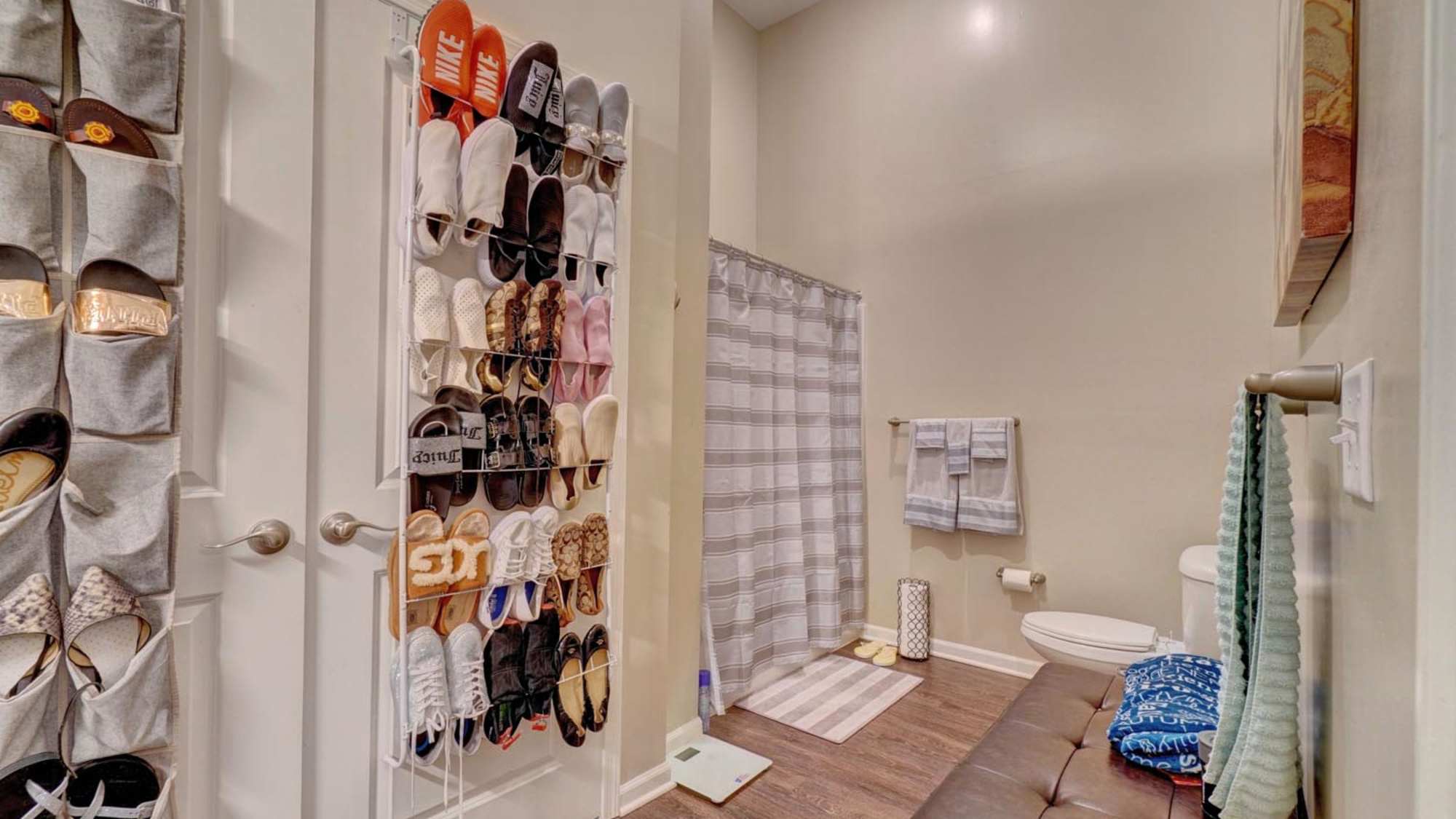 Bathroom with wall-mounted shoe storage at Holley Pointe in Portsmouth. VA