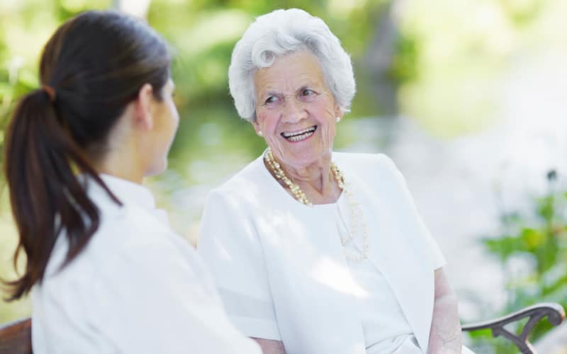 Senior living resident and staff member chatting at Park View Meadows in Murfreesboro, Tennessee