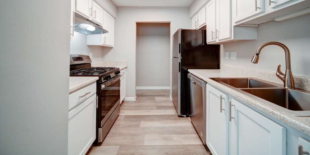 Kitchen with stainless-steel appliance  at The George Apartment Homes in Savannah, Georgia 