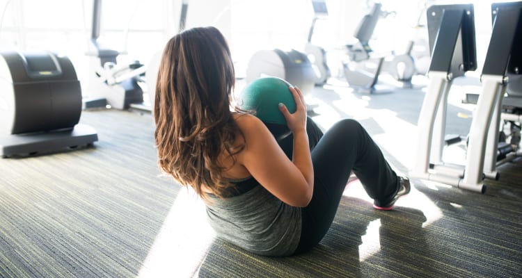 Resident getting in shape in the fitness center at The Core Scottsdale in Scottsdale, Arizona