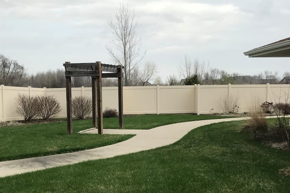 Walking path through the secured grounds at Addington Place of Des Moines in Des Moines, Iowa