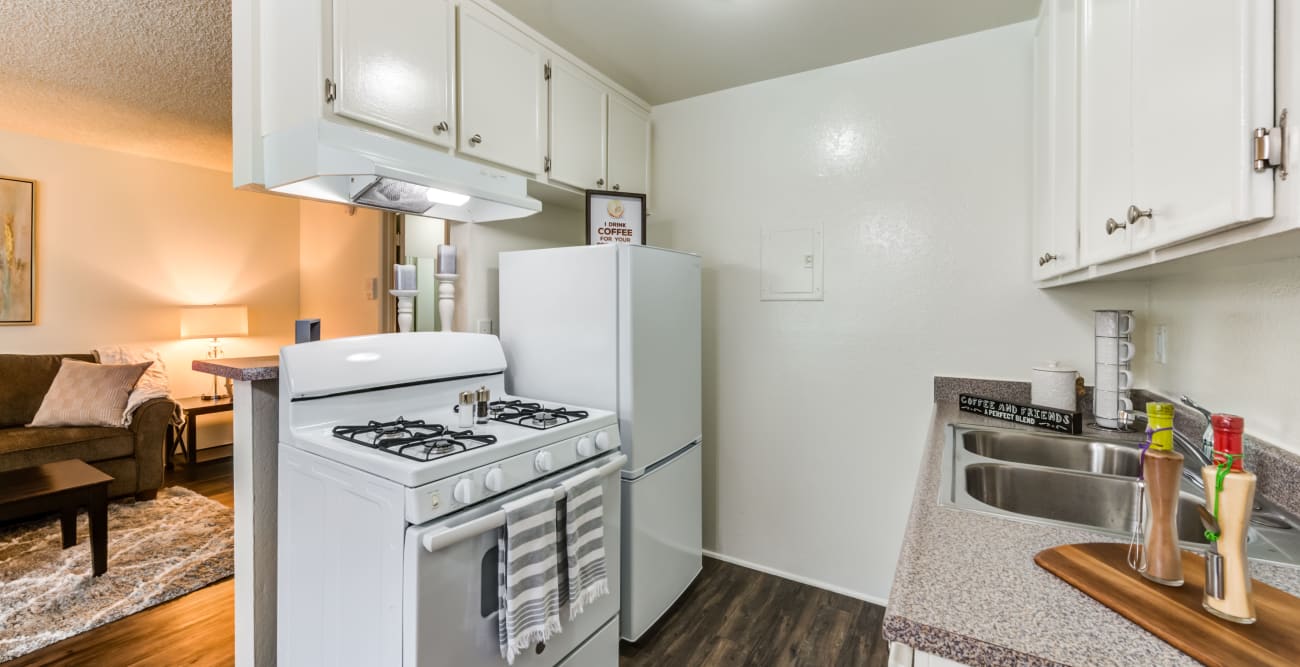 Kitchen with gas range and plank flooring The Pavillion in Tarzana, CA