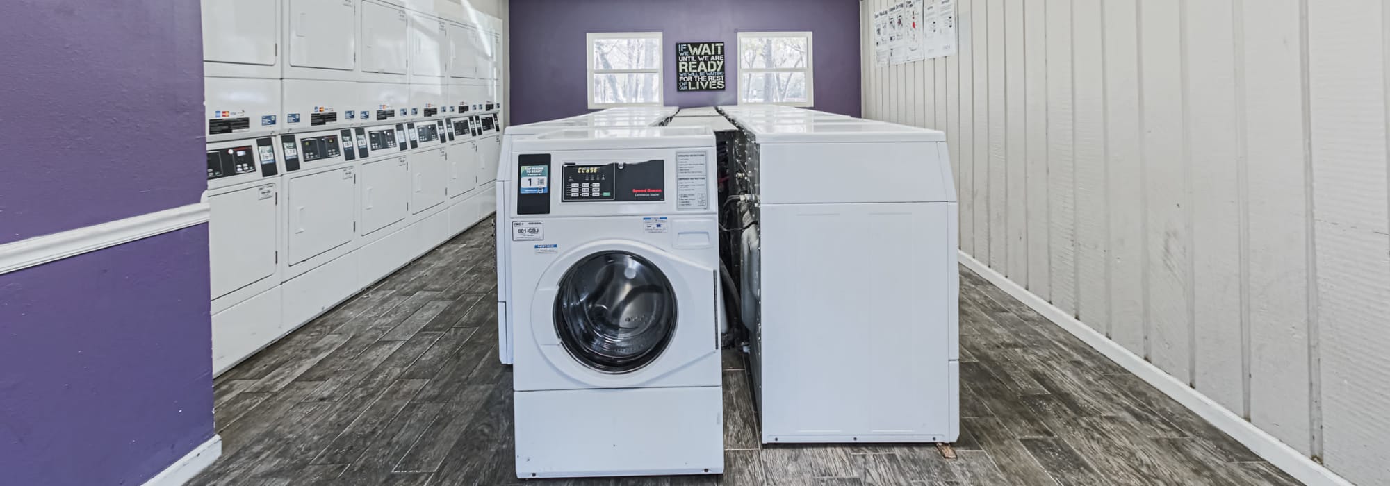 Washers and dryers in the clothes care center at Retreat at 2818 in Bryan, Texas