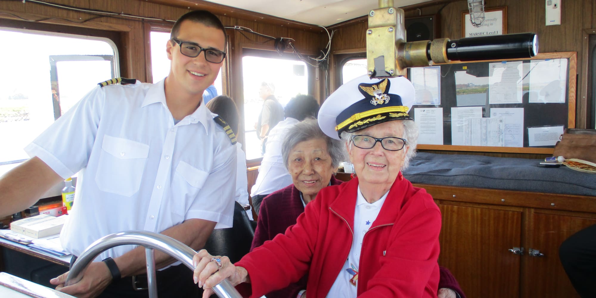 A resident from Mulberry Gardens Assisted Living in Munroe Falls, Ohio steering a boat