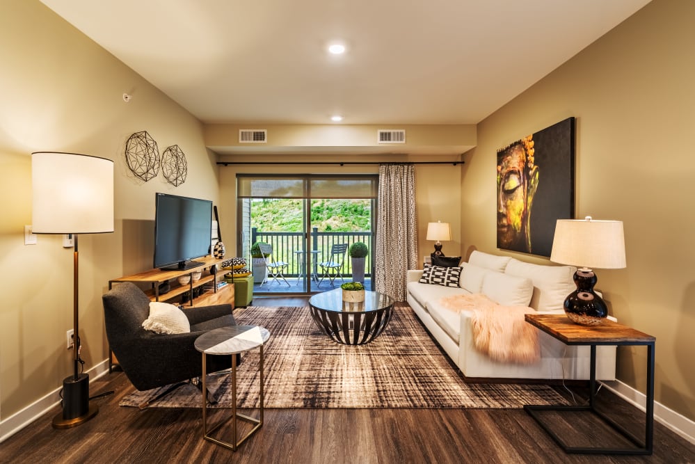 Living room with wood flooring at Cosmopolitan Apartments in Pittsburgh, Pennsylvania