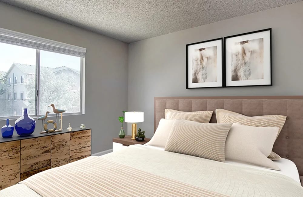 Bedroom with wall art at  The Aurora Apartments in Sparks, Nevada