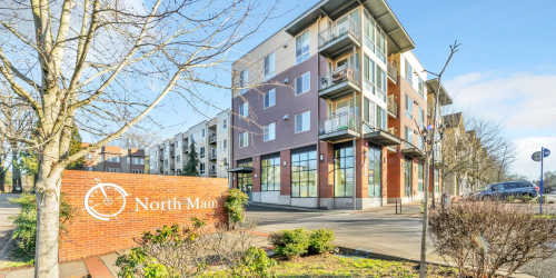 Property exterior with a beautiful signboard at North Main Village in Milwaukie, Oregon