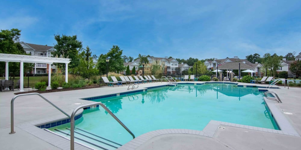 View of the pool with seating at River Forest in Chester, Virginia