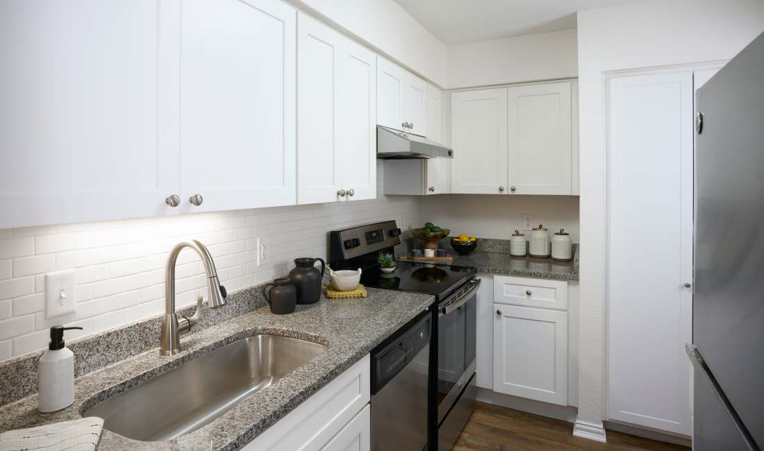Open kitchen and living area at The Fountains of Preston Hollow in Dallas, Texas
