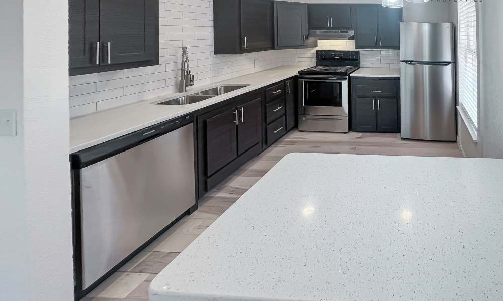 Modern kitchen with stainless-steel appliances at La Villa in Oklahoma City, Oklahoma