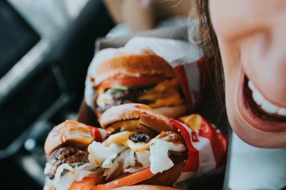 Woman buying burgers near St. Albans Lofts in Raleigh, North Carolina,