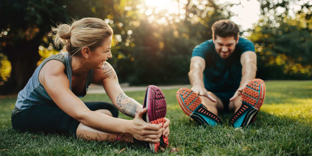 Residents stretching before a jog near Pinnacle at Galleria Apartments in Roseville, California