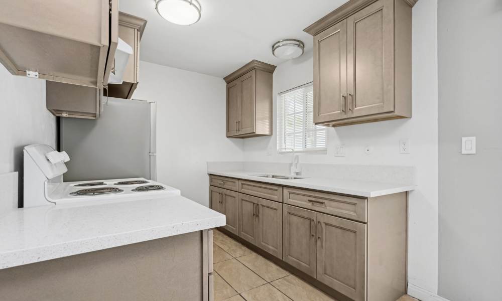 View of kitchen with window at Newland Garden Apartments in Garden Grove, California