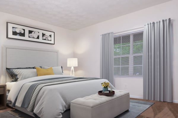 A cozy bedroom at Commons at Briarwood Park in Brookhaven, Georgia