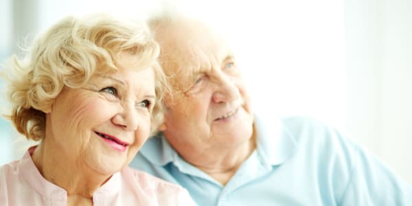 Residents smiling and looking out their window at The Residences on Forest Lane in Montello, Wisconsin