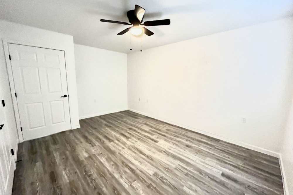 Unfurnished bedroom with a fancy ceiling fan at Grapeland Apartments in Grapeland,Texas