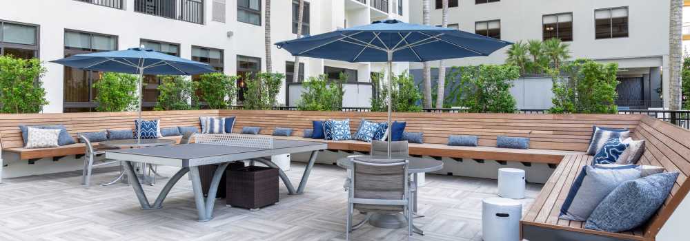 Outdoor lounge with ping pong table at The Whitney in Fort Lauderdale, Florida