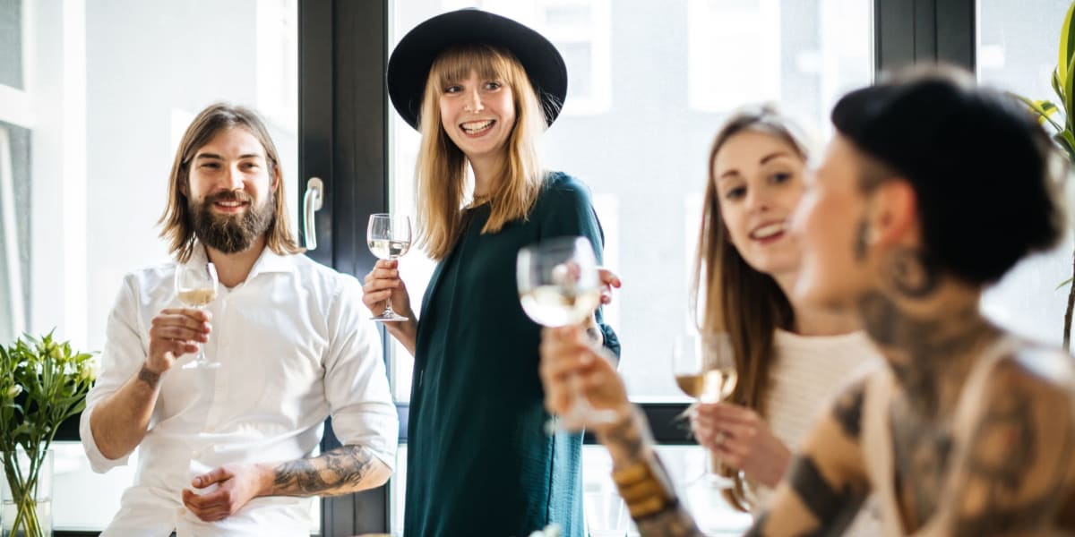 Group of friends drinking wine near The Kendry in Charlotte, North Carolina