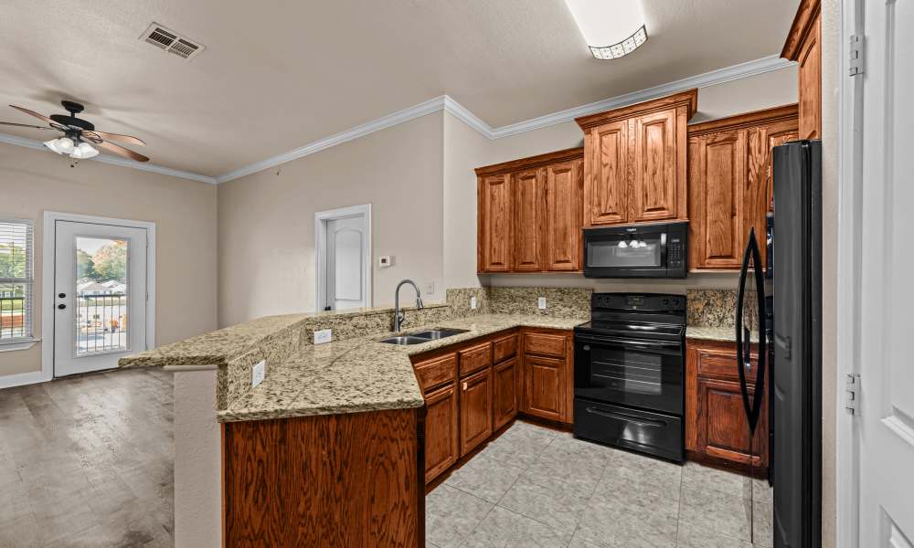Kitchen with granite counter tops at The Arbors of Mineola in Mineola. TX
