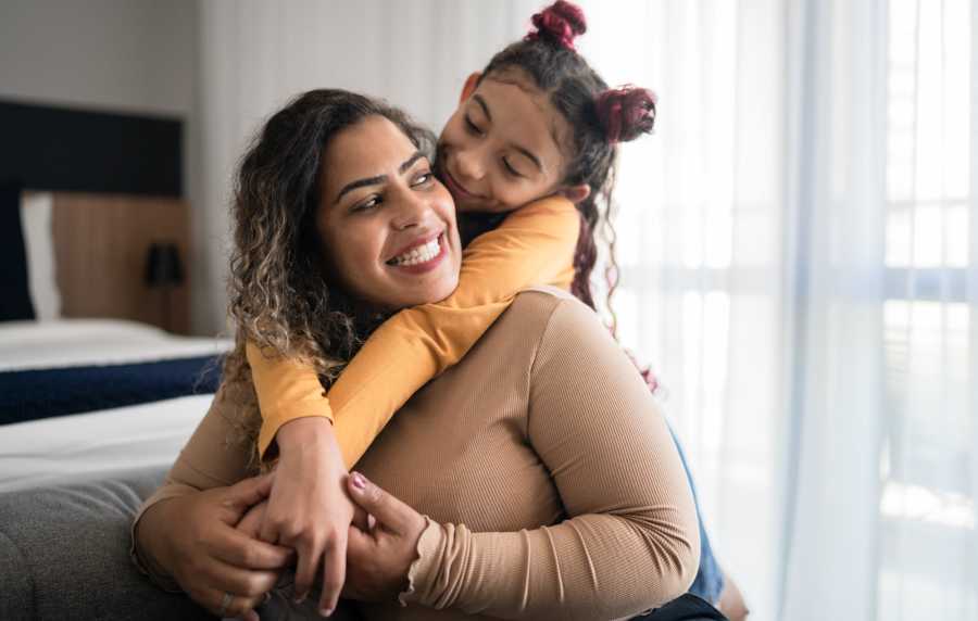 Mother and daughter enjoying cozy apartment at Jefferson Manor Townhomes in Fairport, New York