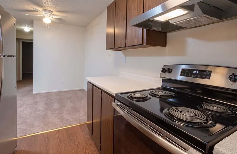 Kitchen with stainless-steel appliances at Park Club Apartments in Rohnert Park, California